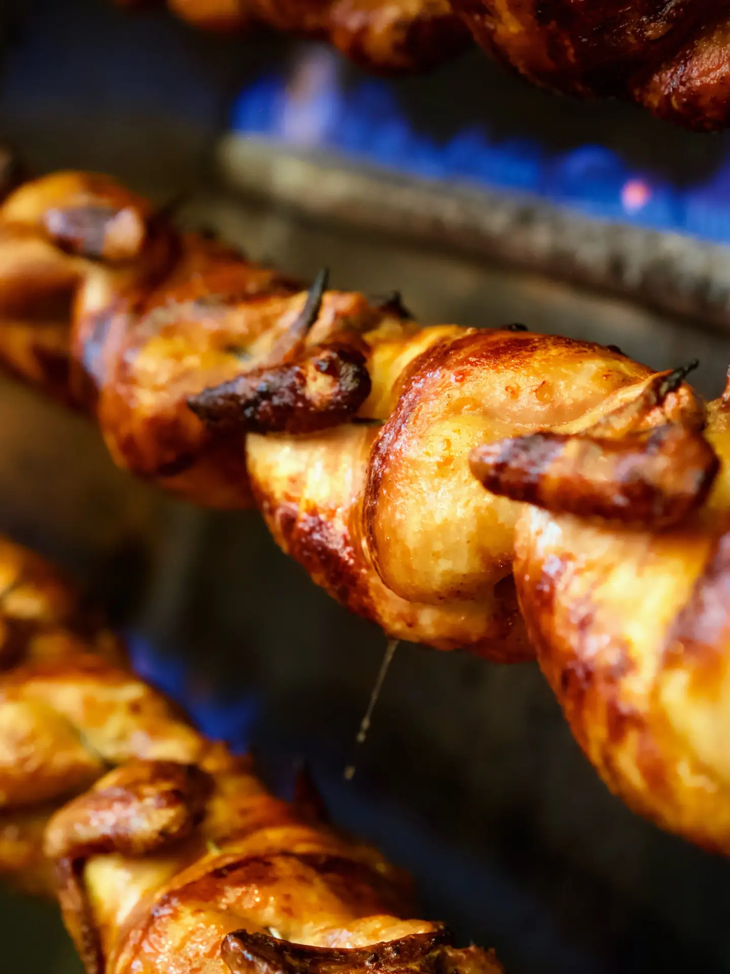Hariri Chickens BBQ chickens roasting over the flame